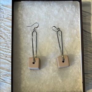 Chic, dangly silver earrings with light pink cubes.
